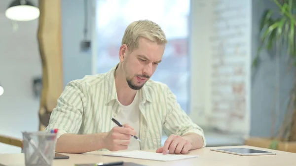 Frustrated Young Man Trying Write Letter — Foto Stock