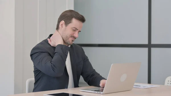 stock image Businessman having Neck Pain while using Laptop