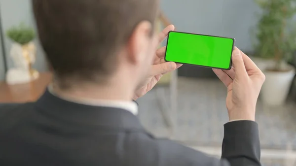 Businessman Holding Smartphone Green Screen — Stock Photo, Image