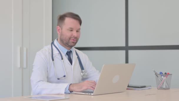 Young Doctor Smiling Camera While Working Laptop — Stock Video