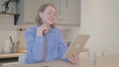 Young Woman Doing Video Chat on Tablet