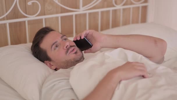 Young Man Talking Phone Bed — Stock Video