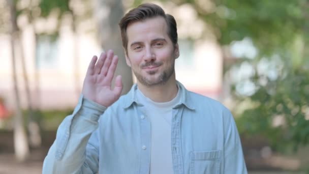 Outdoor Portrait Young Man Waving Say Hello — Stock Video