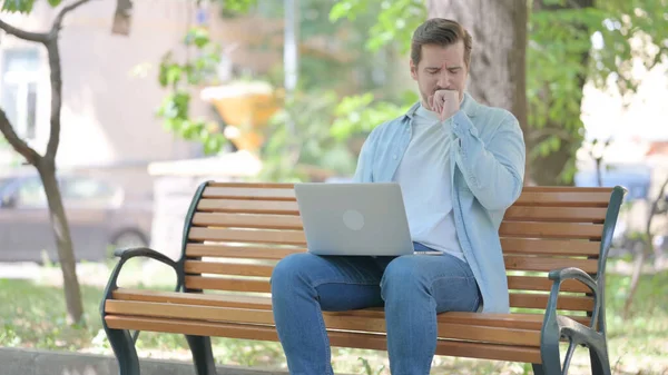 Coughing Young Man Using Laptop Outdoor — Stock Photo, Image