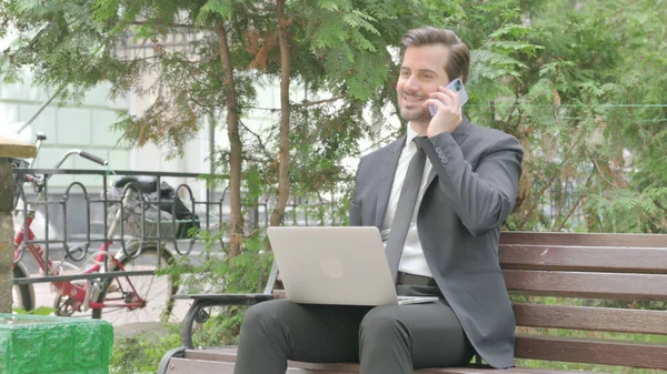 Middle Aged Businessman Talking Phone Using Laptop Outdoor — Stock Photo, Image