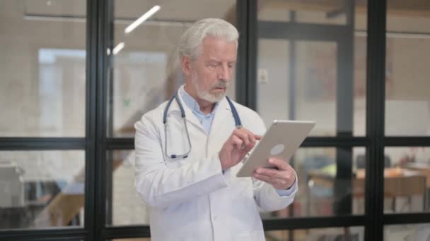Senior Old Doctor Using Digital Tablet While Standing Hospital — Stock Video