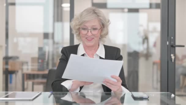 Senior Businesswoman Celebrating While Reading Documents — Stock Video