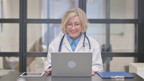Old Female Doctor Talking Patient Online — Stock Video