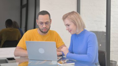 Creative People Working on Laptop in Office