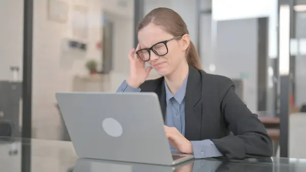 Stock image Businesswoman with Headache at Work