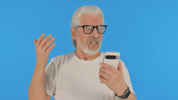 Casual Old Man Shocked by Loss on Phone on Green Background, Portrait