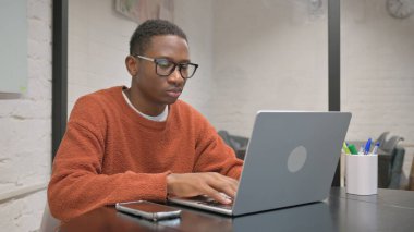African American Man Working on Laptop