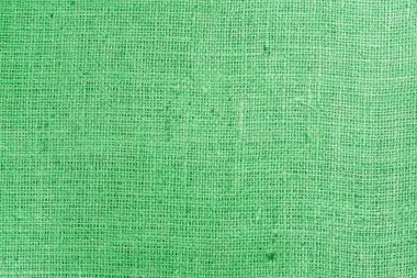 Yeşil bez kumaş, tuvalin üzerinde gerçek keten iplikler ve yeşil keten kumaş örnekleri gibi güzel keten dokular.