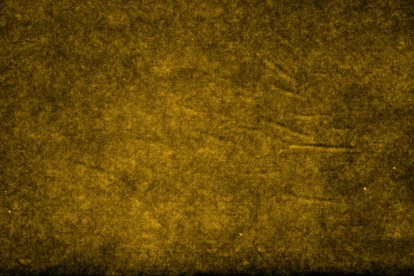 Beautiful golden background with paper texture with golden light of golden leather background as sample of golden background from natural paper or texture of paper for beautiful background