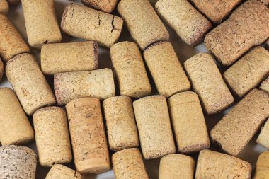 Abstract background of wine corks with corks from red wine bottles and corks from white wine bottles among other wine corks