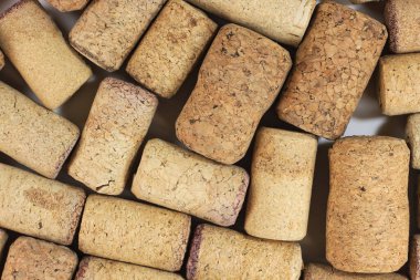 Abstract background of wine corks with corks from red wine bottles and corks from white wine bottles among other wine corks