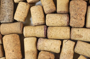 Abstract background of wine corks with corks from red wine bottles and corks from white wine bottles among other wine corks