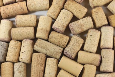 Abstract background of wine corks with corks from red wine bottles and corks from white wine bottles among other wine corks
