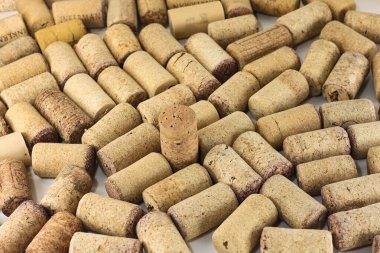 Abstract background of wine corks with corks from red wine bottles and corks from white wine bottles among other wine corks