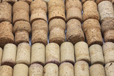 Abstract background of wine corks with corks from red wine bottles and corks from white wine bottles among other wine corks
