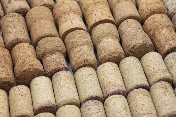 Abstract background of wine corks with corks from red wine bottles and corks from white wine bottles among other wine corks