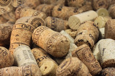 KYIV  UKRAINE - FEBRUARY, 18, 2023: Wine corks editorial background with dates and drops of wine on February 18, 2023 in Kyiv, Ukraine