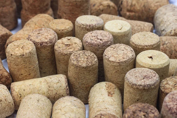 Abstract background of wine corks with corks from red wine bottles and corks from white wine bottles among other wine corks