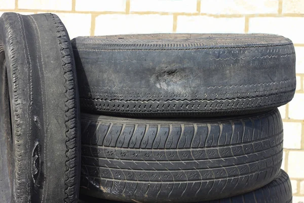 stock image old worn out summer tire next to another old summer tire as sample of damaged summer tires from two summer tires