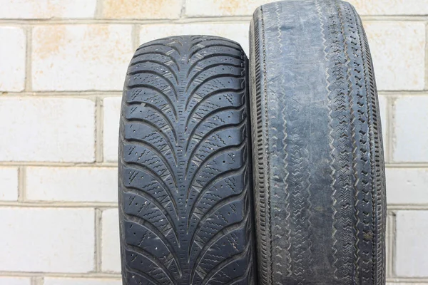 old winter tire as sample of damaged tires from summer and winter tires