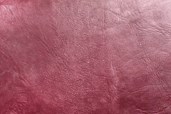Beautiful red background with leather texture with red veins of red leather background as sample of red background from natural leather or sample of texture of leather for beautiful natural background