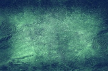 Yeşil deri damarları olan yeşil derili güzel yeşil arkaplan doğal deriden yeşil arkaplan örneği ya da güzel doğal arkaplan için deri dokusu örneği.