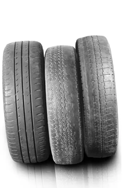 stock image old worn damaged tires isolated on white background as pattern of damaged tire for advertising tire shop or car tire shop