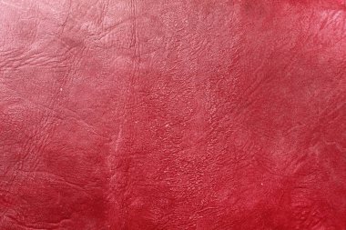 Beautiful red background with leather texture with red veins of red leather background as sample of red background from natural leather or sample of texture of leather for beautiful natural background