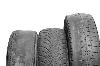 old worn damaged tires isolated on white background as pattern of damaged tire for advertising tire shop or car tire shop clipart