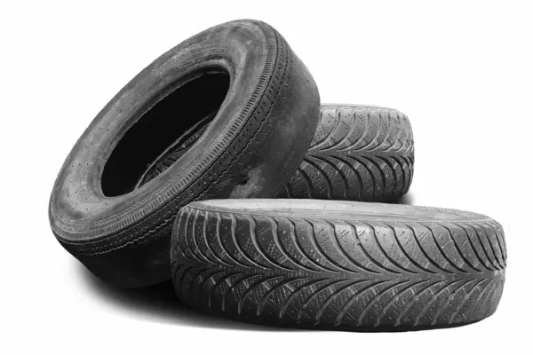 stock image old worn damaged tires isolated on white background as pattern of damaged tire for advertising tire shop or car tire shop