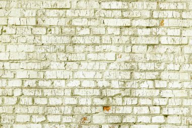 Sarı tuğlalardan yapılmış olağandışı sarı tuğlalar ve soyut sarı arkaplan için kırık sarı tuğlalar olan tuğla duvar.