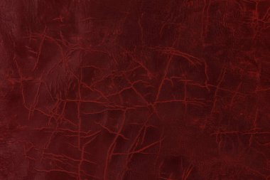 Beautiful red background with leather texture with red veins of red leather background as sample of red background from natural leather or sample of texture of leather for beautiful natural background