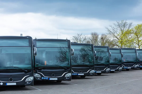 Stock image many busses at a bus station lined up parking