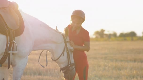 Woman Red Uniform Caresses Hugs Strokes White Horse Medium Shot — Stock Video