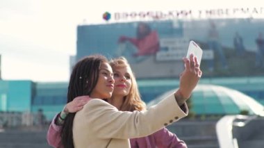 Young african american woman is meeting with business partner or client and discussing future plans for the project, making happy selfie