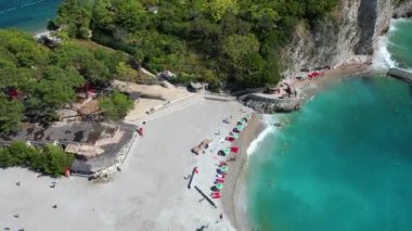 Sveti Nikola Saint Nicholas Island from drone in blue adriatic sea, Budva tourist resort, Montenegro