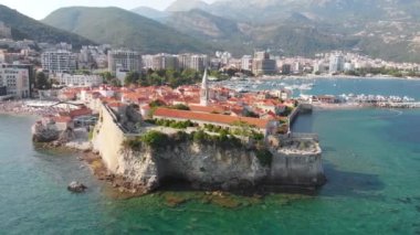 Aerial view of Budva, old and modern city on Adriatic Sea coast. Center of Montenegrin tourism and popular sea resort.