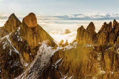 Mountain landscape after first snow in Dolomites mountains, Catinaccio Rosengarten range, Italy