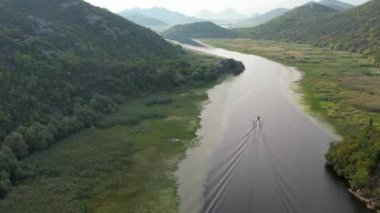 Aerial view to Rijeka Crnojevica in the morning. Skadar Lake, Montenegro. Cinematic shot.