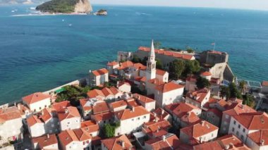 Aerial view of Budva, old and modern city on Adriatic Sea coast. Center of Montenegrin tourism and popular sea resort.