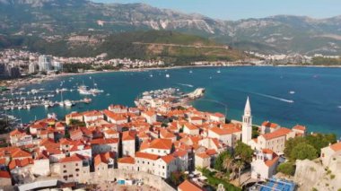 Aerial view of Budva, old and modern city on Adriatic Sea coast. Center of Montenegrin tourism and popular sea resort.