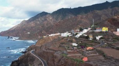 Aerial sunset view of dramatic Atlantic Ocean coastline of Anaga, steep cliffs and small villages, Tenerife, Canary Islands, Spain