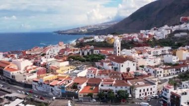 Aerial morning view of Garachico city center with colored houses. Old town of Garachico on island of Tenerife, Canary. Ocean shore and lava pools. Popular tourist destination, pearl of the Canary