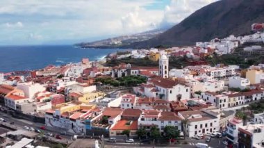 Aerial morning view of Garachico city center with colored houses. Old town of Garachico on island of Tenerife, Canary. Ocean shore and lava pools. Popular tourist destination, pearl of the Canary