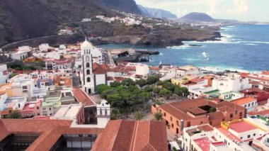 Aerial morning view of Garachico city center with colored houses. Old town of Garachico on island of Tenerife, Canary. Ocean shore and lava pools. Popular tourist destination, pearl of the Canary